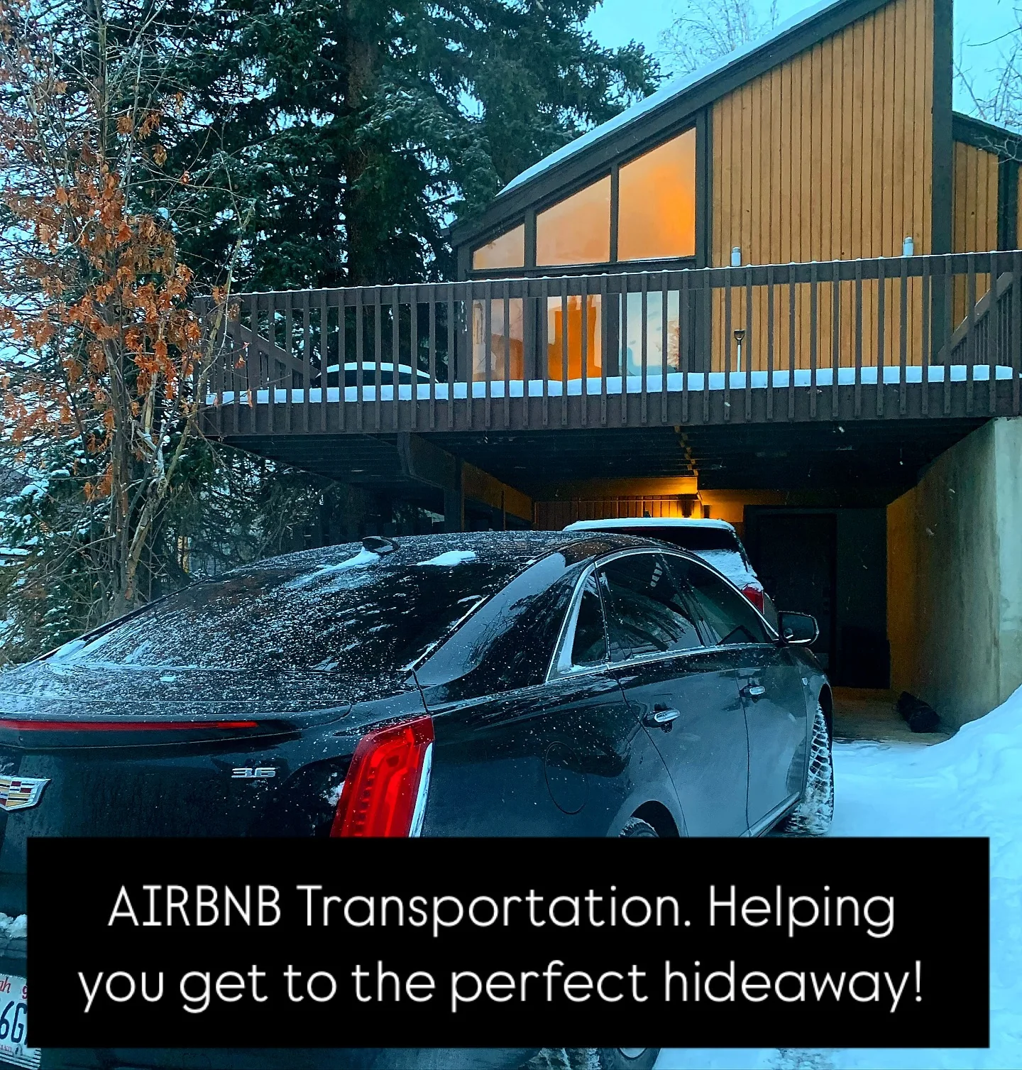 Luxury black SUV serving a snow-covered Park City resort